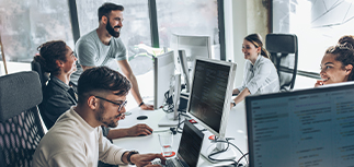 People working in an office using the latest software solutions