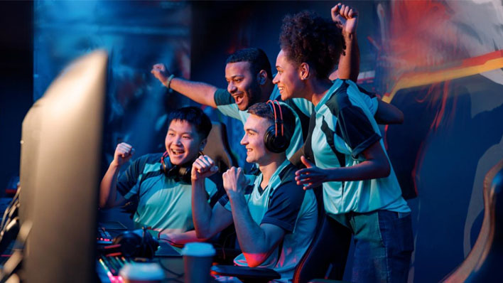  A team of esports students celebrates after winning a tournament game