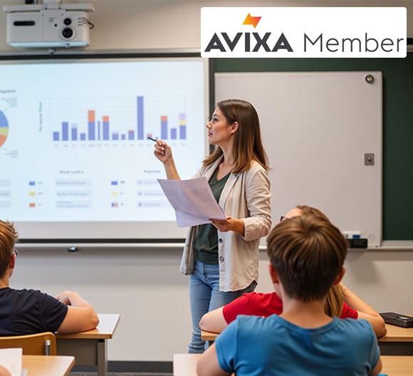 A teacher using Converge AV solutions to teach a class of children