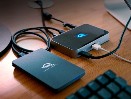 A HDMI adapter from OWC showing 2 ports with a cable to connect to your device