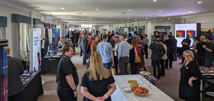 Converge members at a conference discussing sustainable it solutions