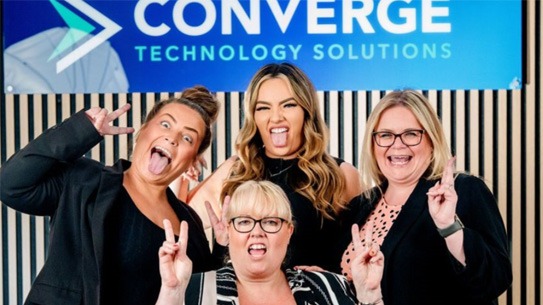 Converge Employees posing for a photo together and having fun