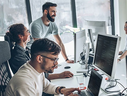 People at work using devices from Converge in an office setting