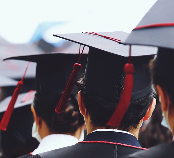 Student dressed in graduation outfits