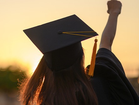 A student celebrating graduation