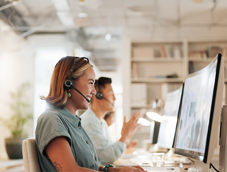 A person at Converge helping a customer on the phone