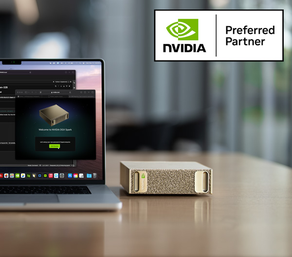 NVIDIA DGX Spark Device next to a laptop on a table with the NVIDIA preferred partner logo
