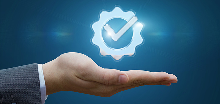 A hand with a warranty icon hovering above it