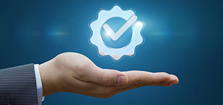 A hand with a warranty icon hovering above it